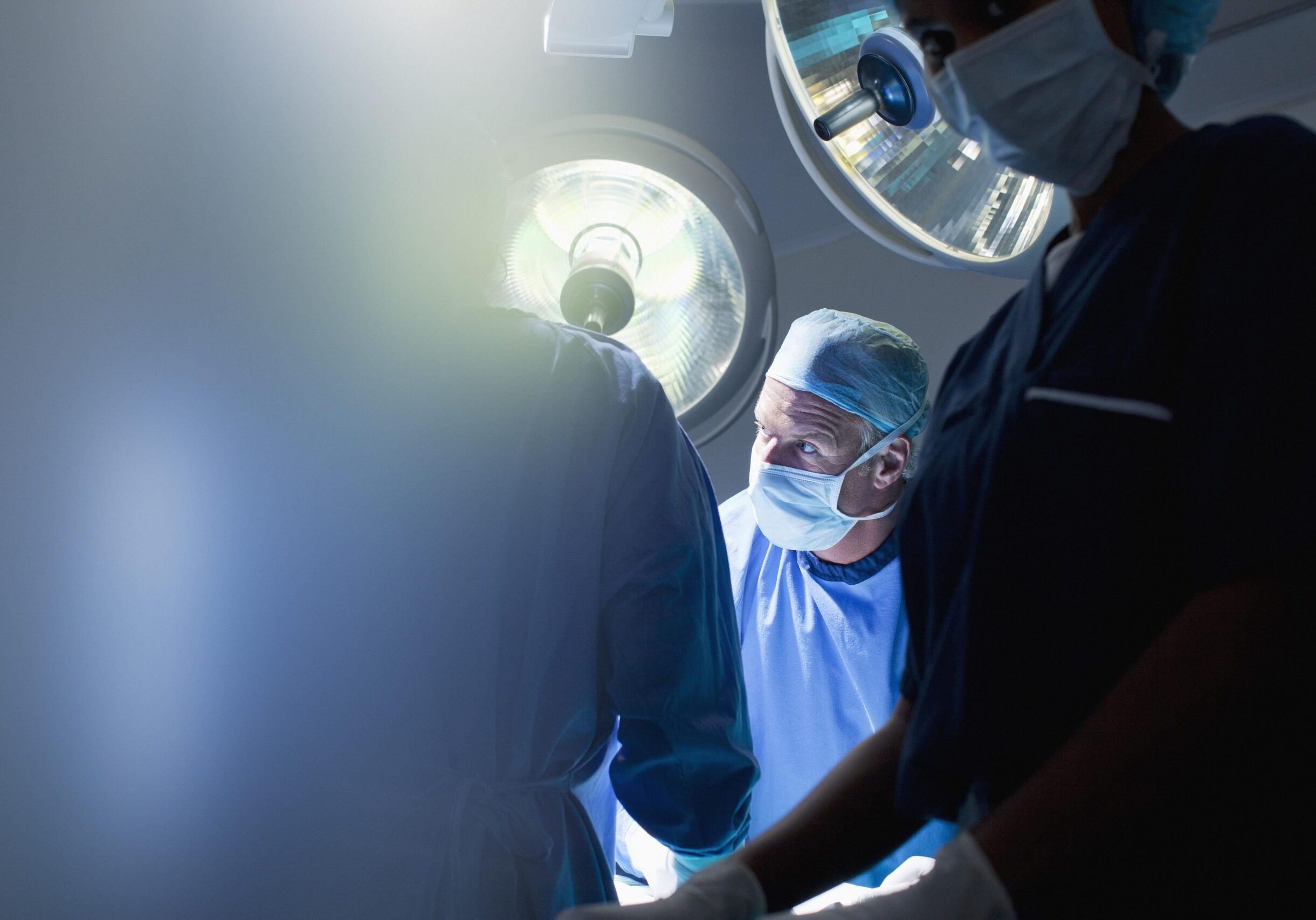 Surgeons working in operating room